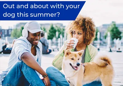 man and woman sat with dog